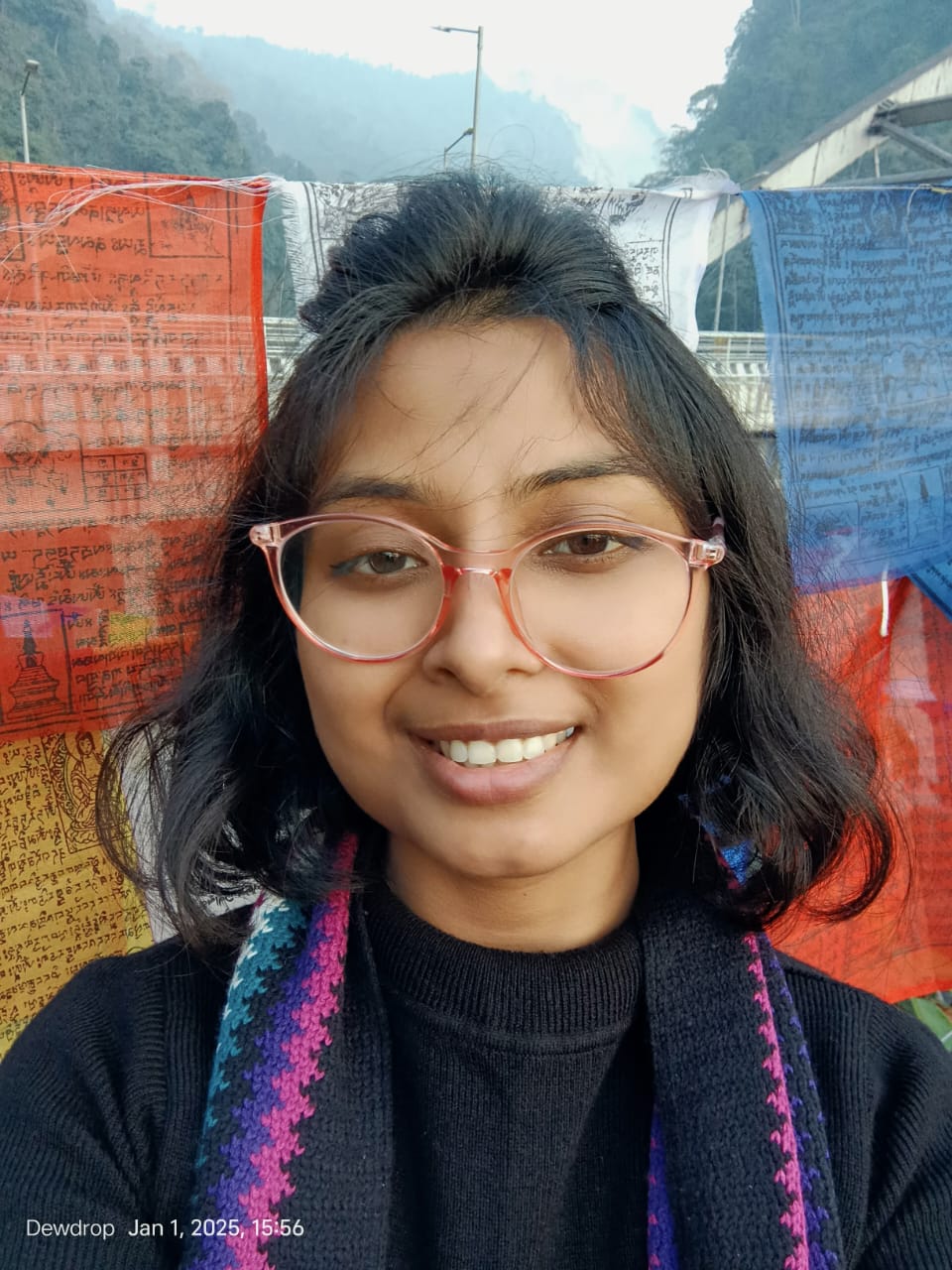 Tanusree Barman, a young woman from Cooch Behar, smiling confidently in her testimonial image for Sujyoti Language School. The text highlights her journey from an online English learner in the ELC course to becoming a paid part-time trainer after completing DELCA.